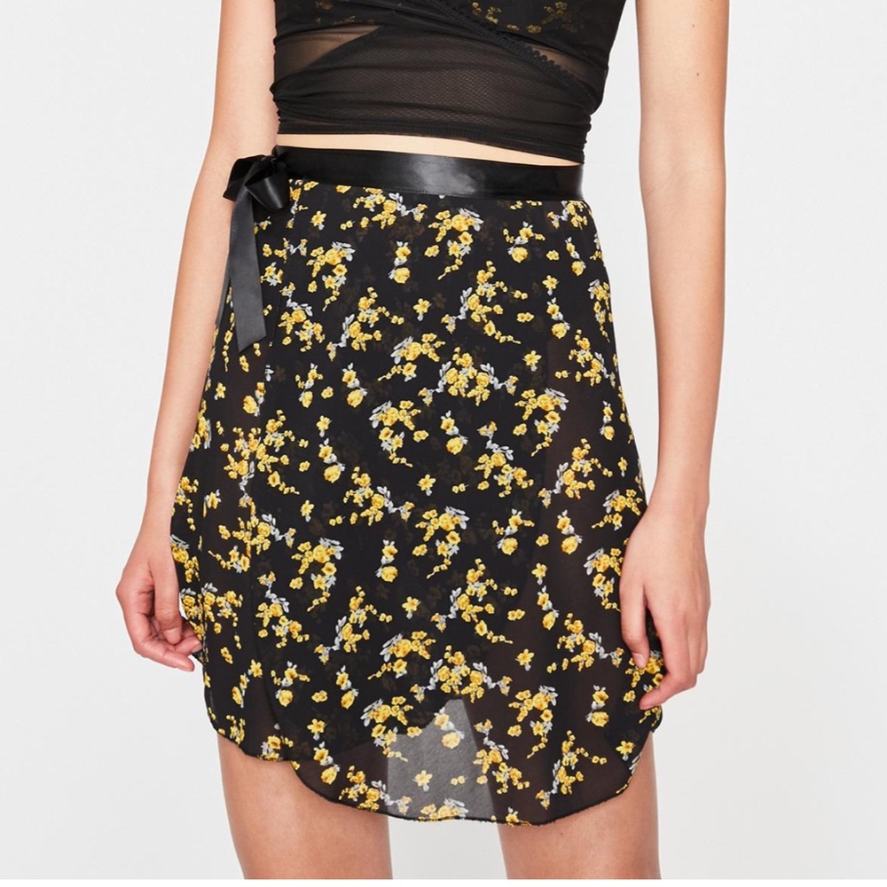 A small yellow and black chiffon wrap skirt